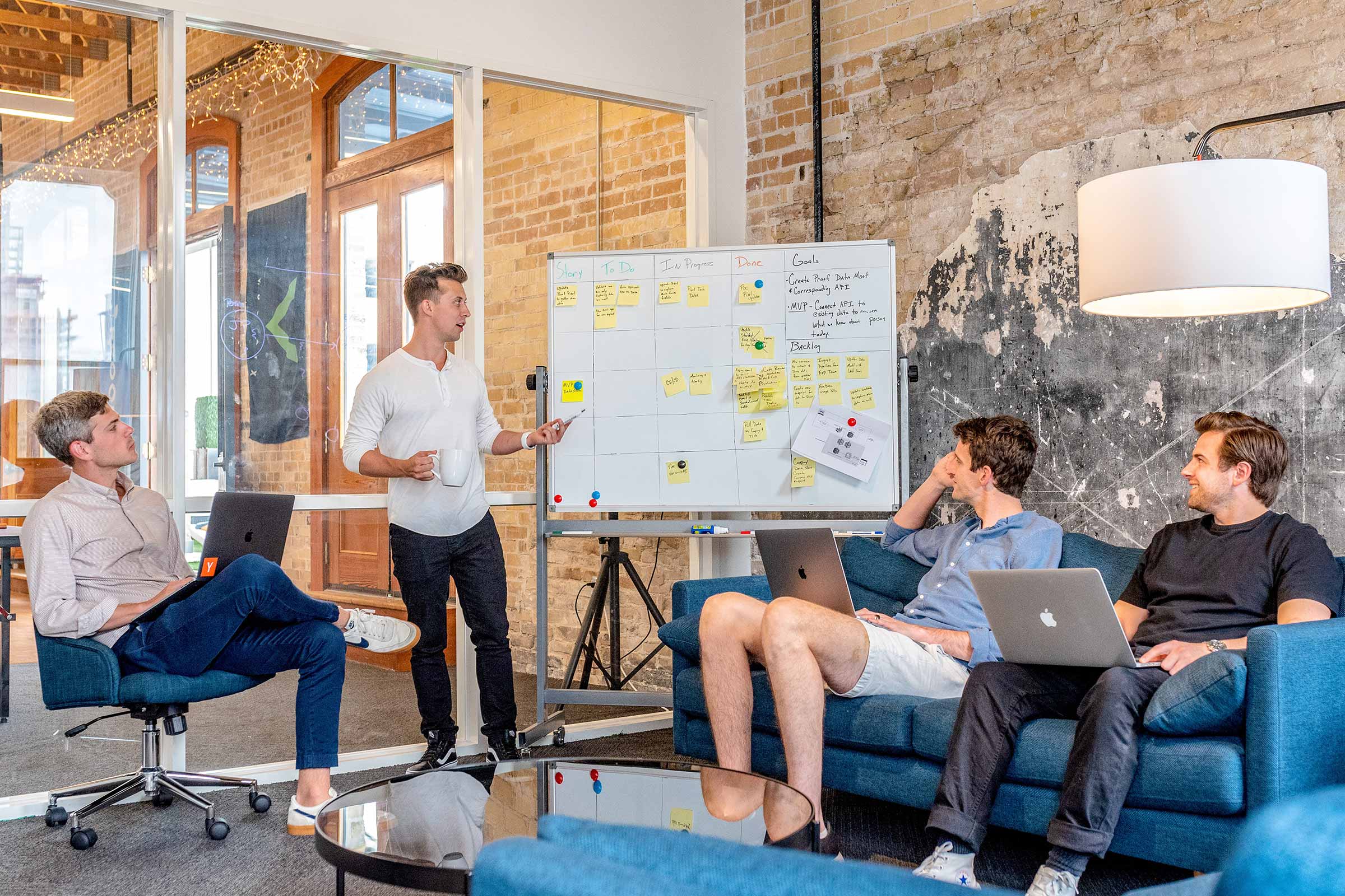 Team collaborating around a whiteboard during a planning session